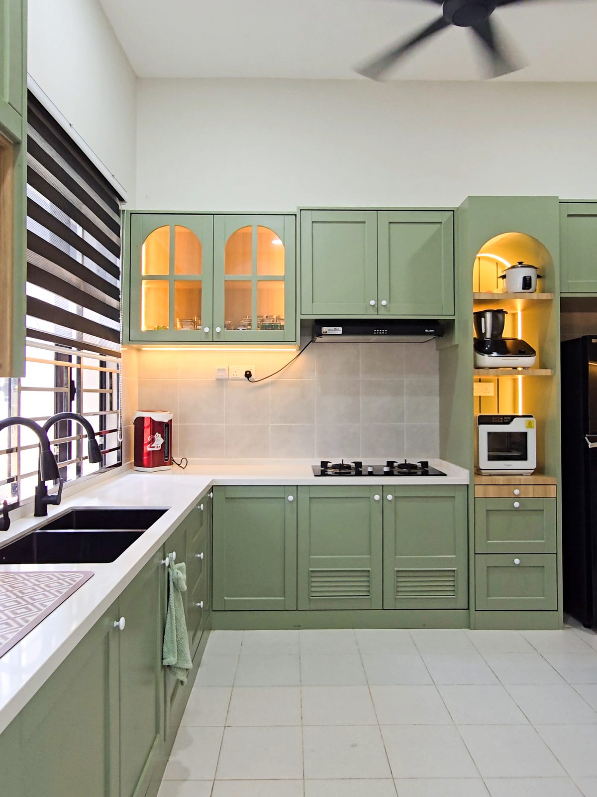 Classic sage-green L-shaped kitchen