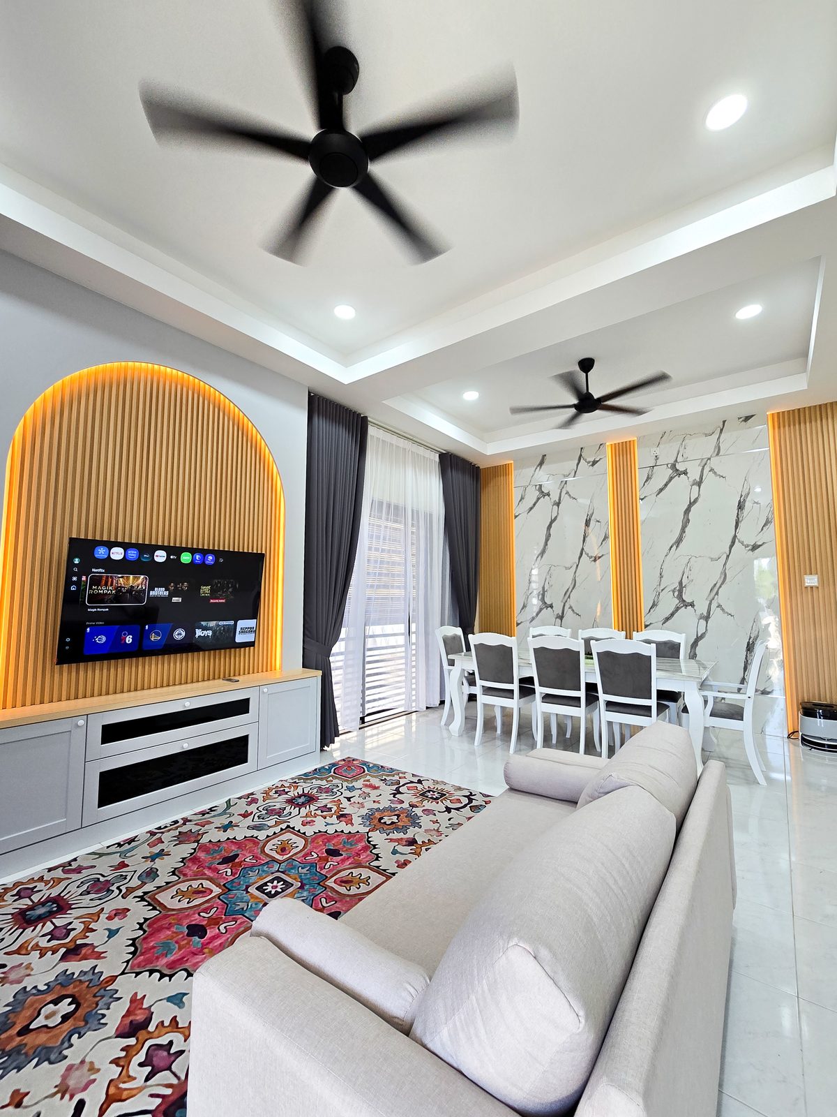 Living area with arched TV feature wall