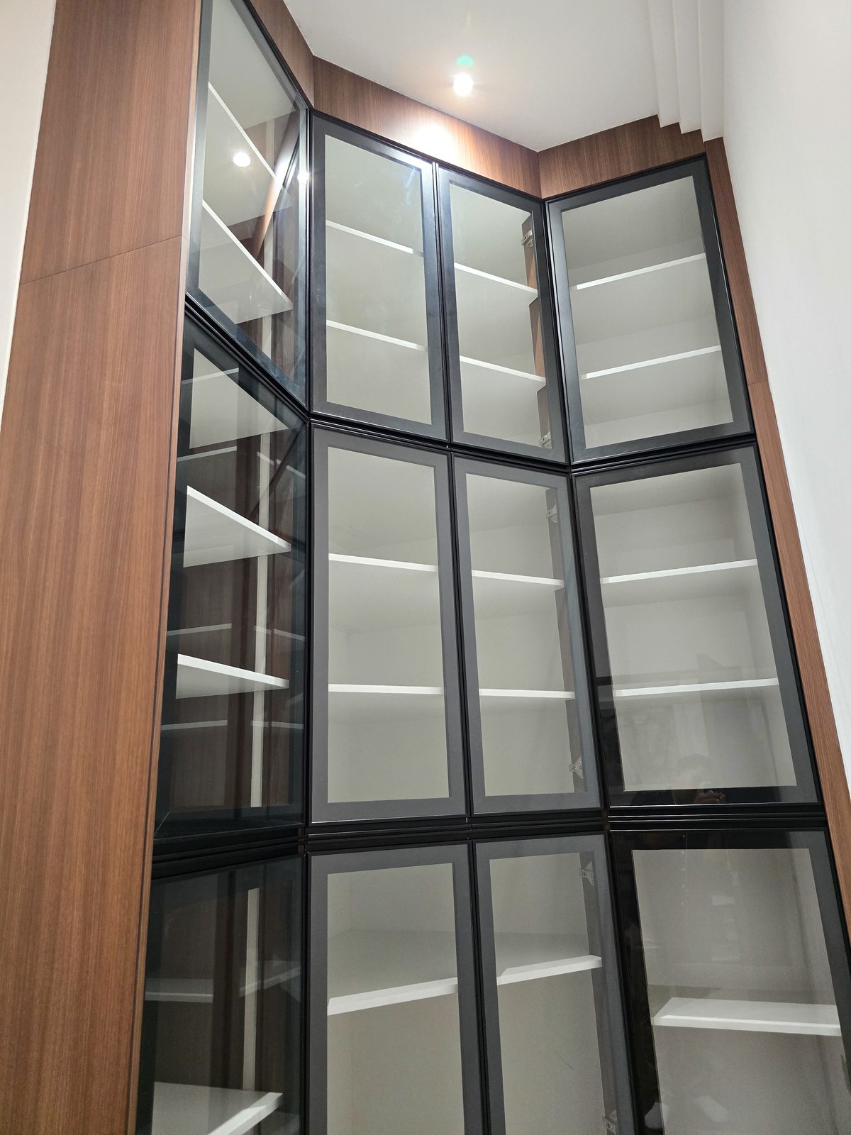 Tall backlit glass display shelving