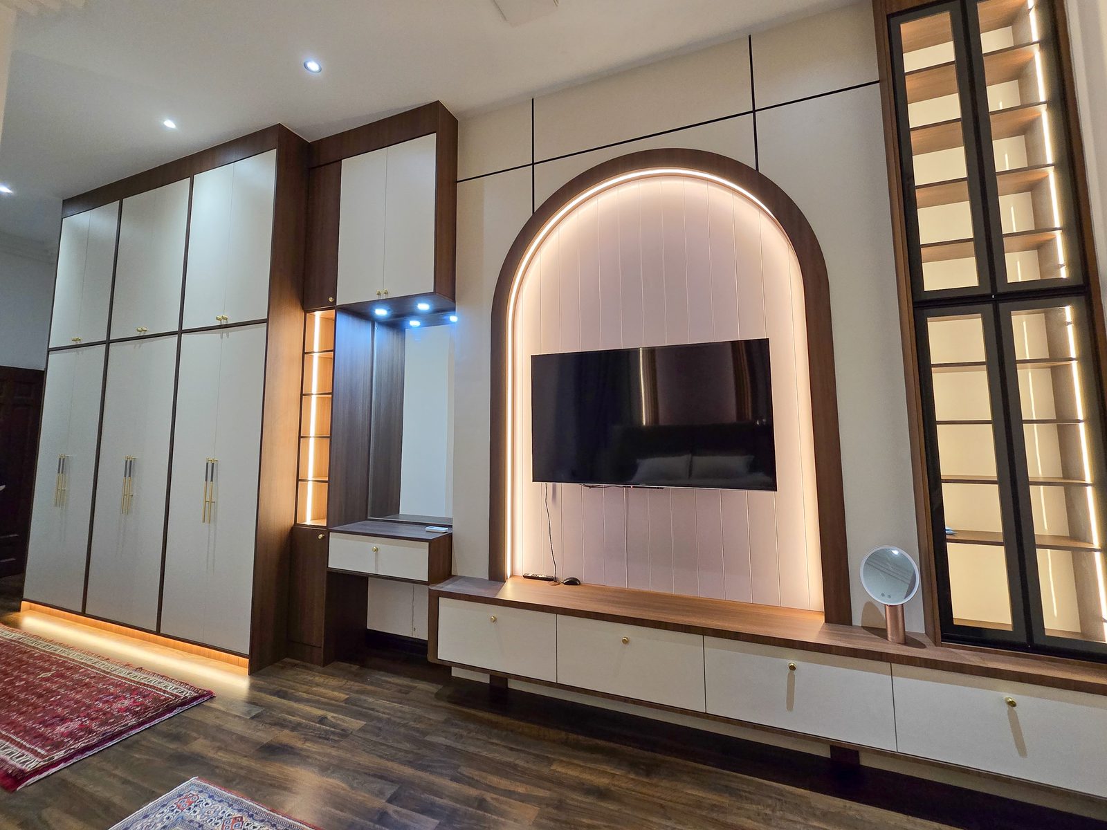 Arched TV feature wall with wardrobes and walnut accents