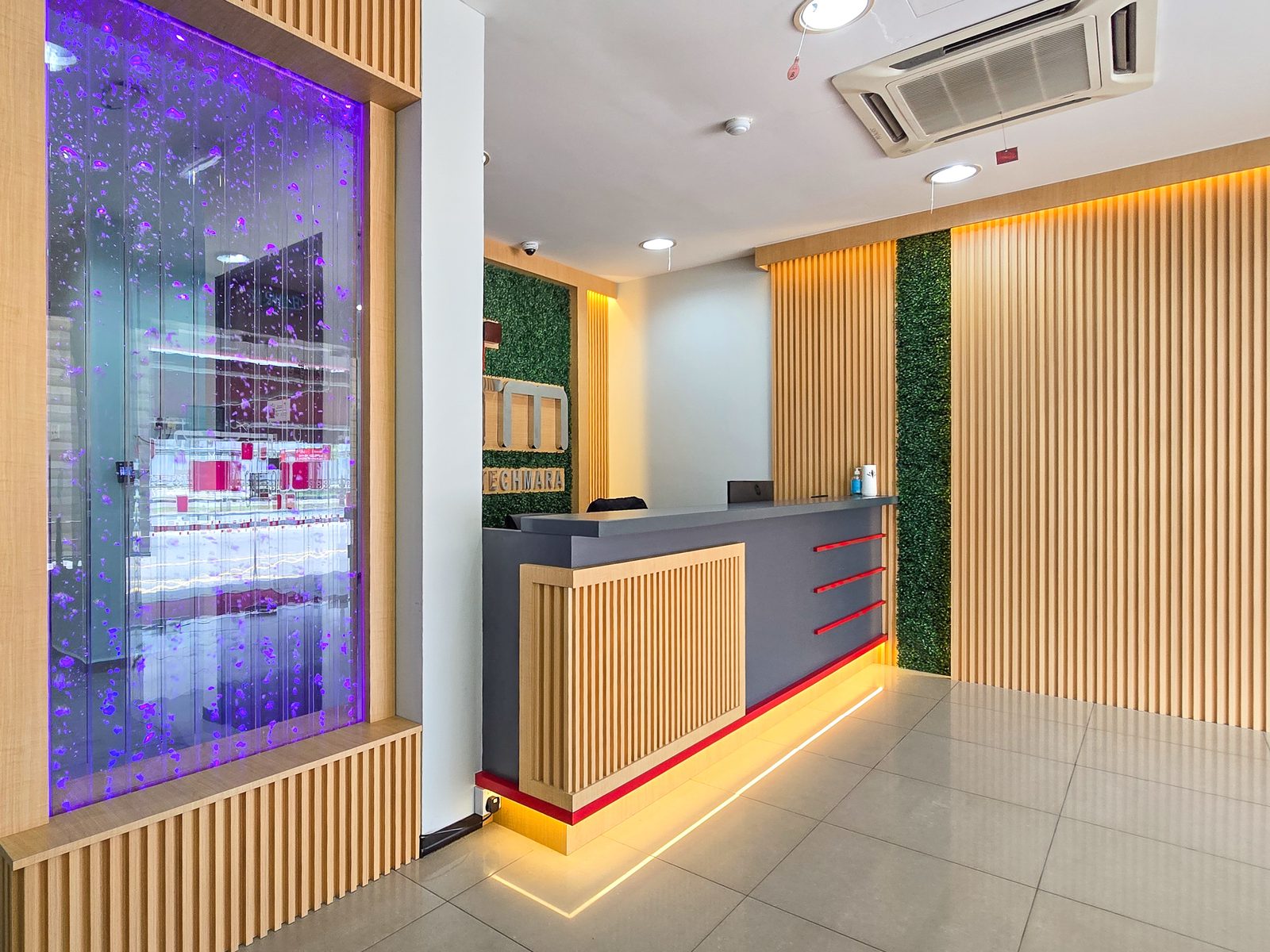 KPTM lobby with backlit bubble water feature panel