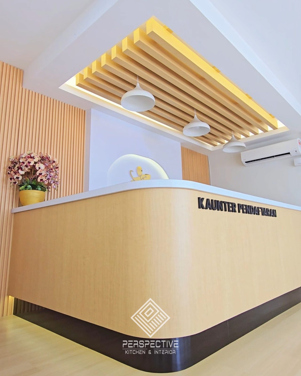 Registration counter with timber panelling and cove lighting