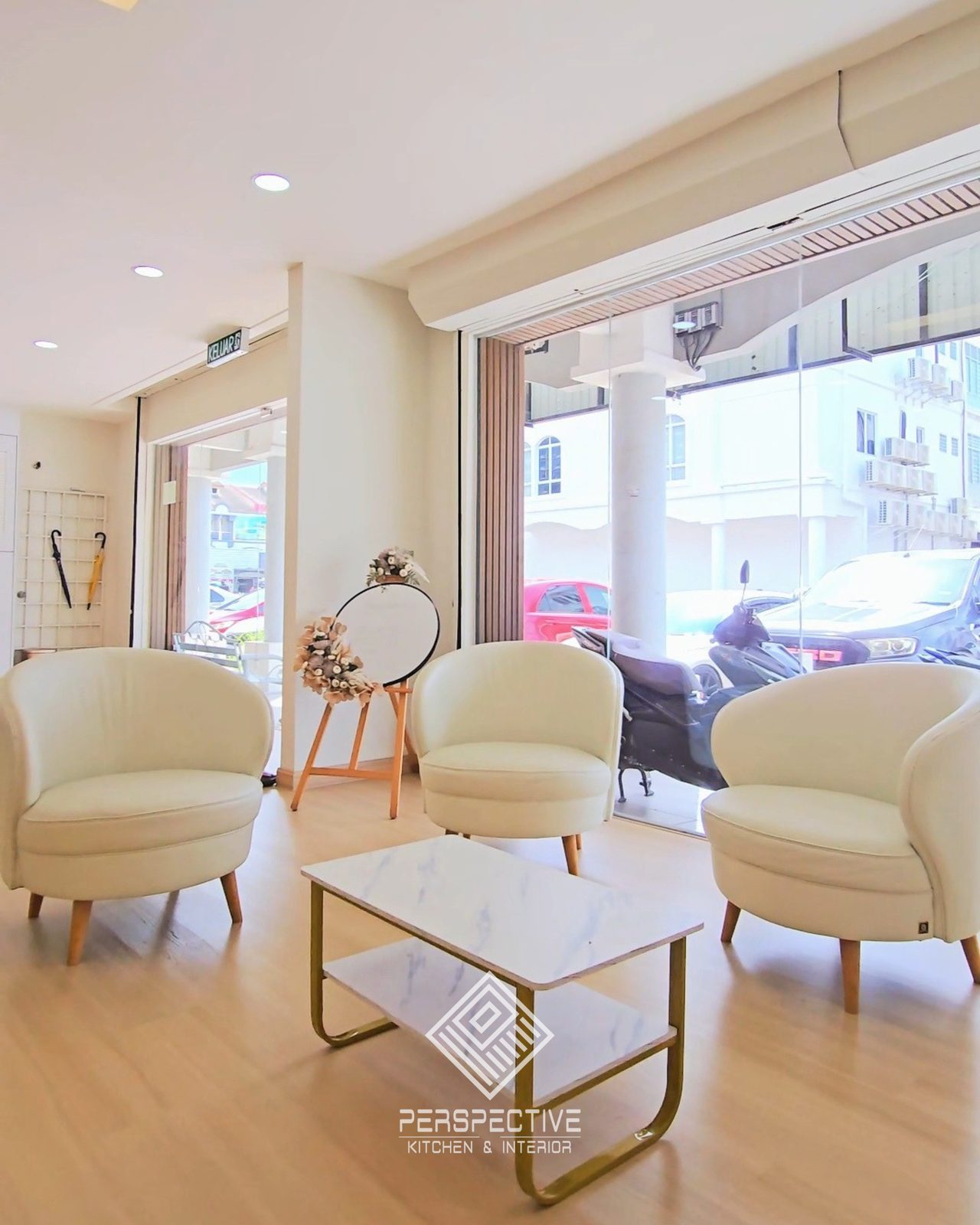 Waiting lounge with cream armchairs at Pusat Terapi Dr Mazlan