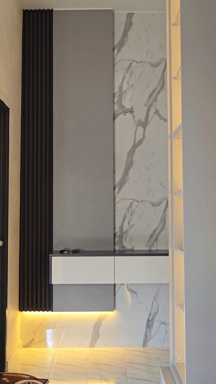 Marble wall panel with concealed cove lighting