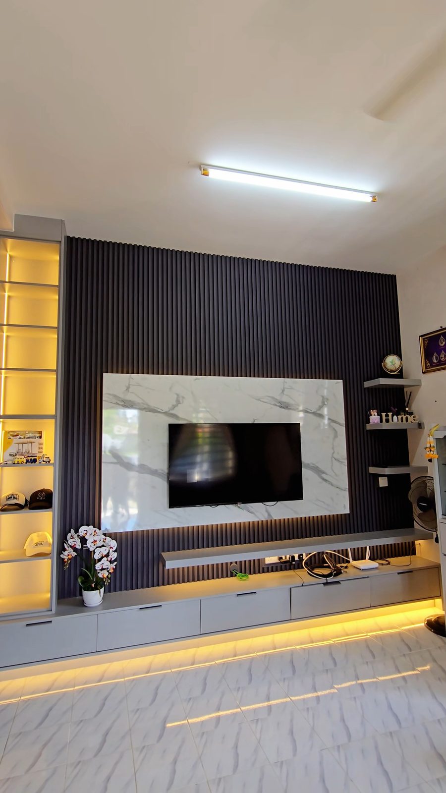 Fluted charcoal TV feature wall with marble