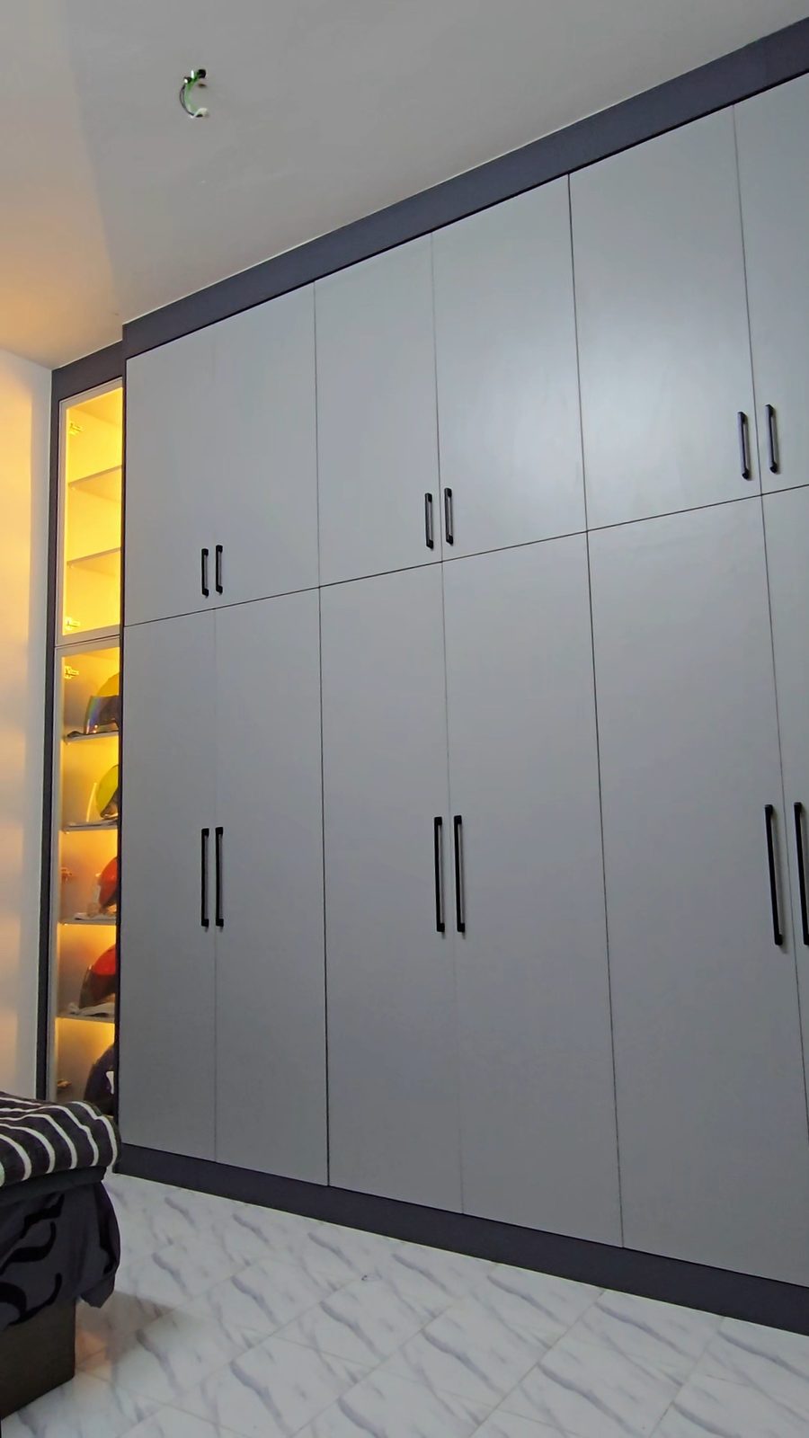 Full-height grey master wardrobe